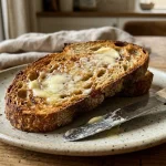Sourdough toast spread with melting cultured plant-based butter