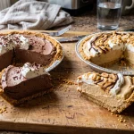 Assortment of homemade no-bake pies with chocolate and peanut butter slices